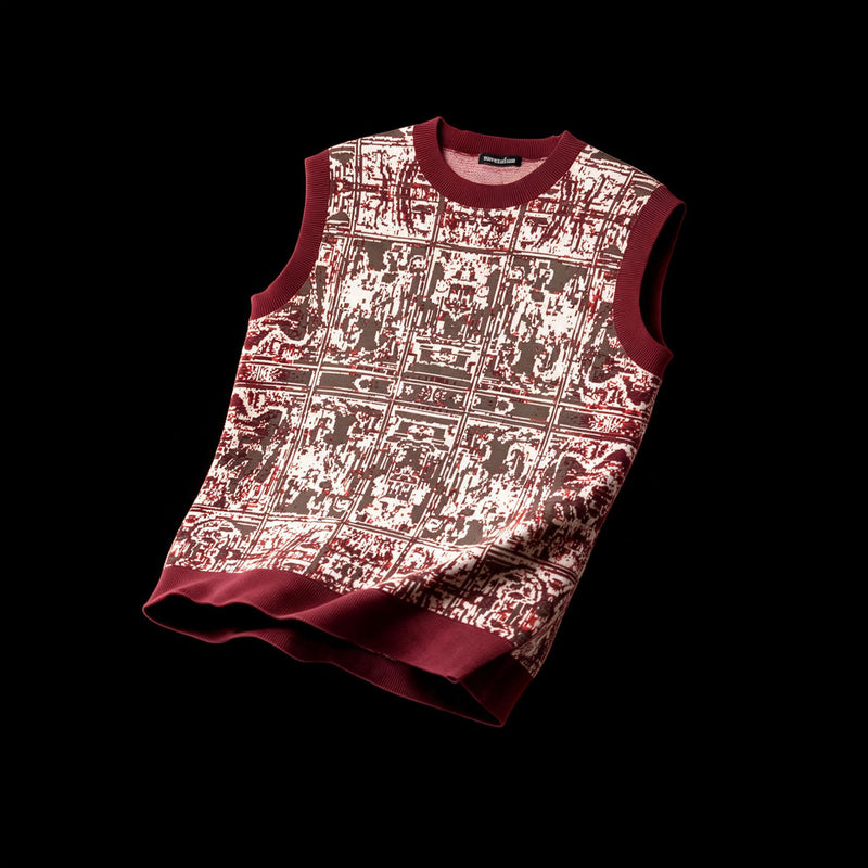 Sleeveless jacquard knit vest with a worn tapestry pattern in deep red, brown and cream, ribbed red trim