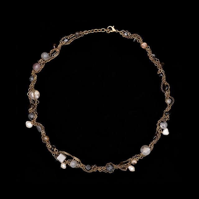 Woven brass necklace with gray labradorite beads and cream freshwater pearls set among twisted chains