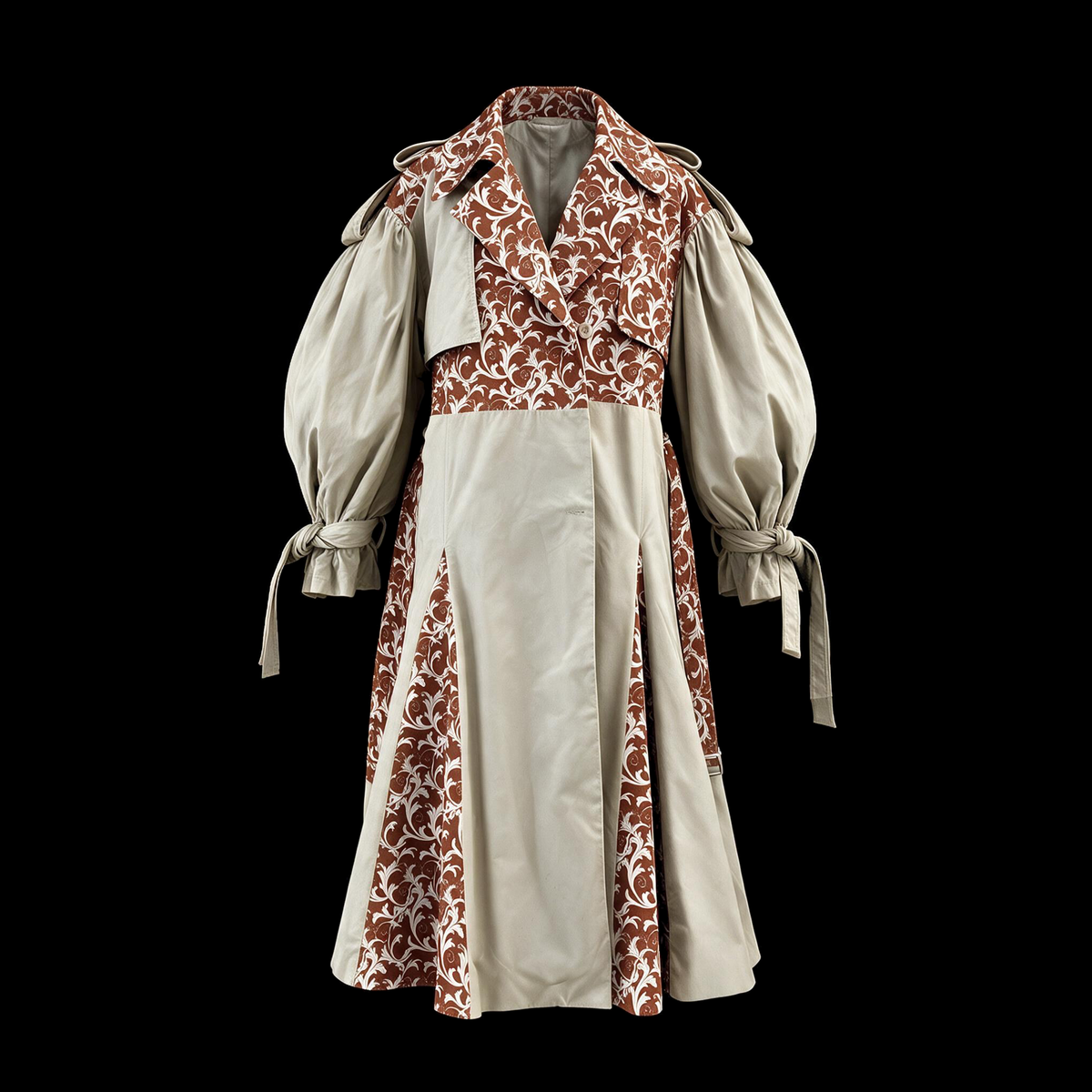 Long beige trench coat with rust floral panels and puff sleeves on black
