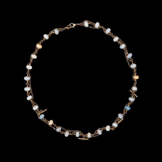 Beaded necklace in dusty blue, apricot and ivory rondelles on a fine gold tone chain