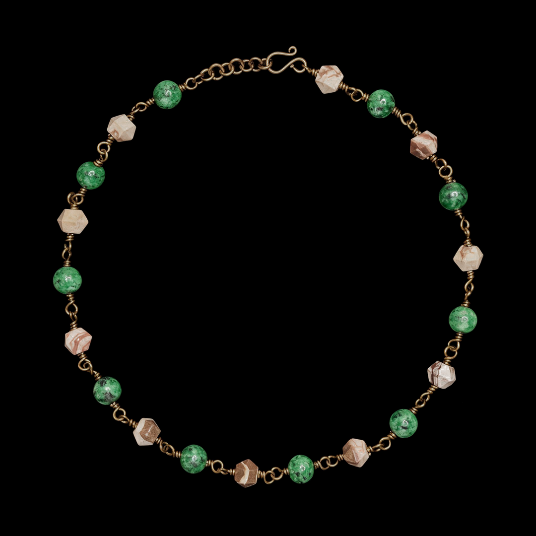 Beaded necklace with mottled green and faceted beige stone beads on a patinated chain